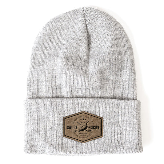 Knit beanie with logo stamped on full grain leather patch.  Sauce on the Biscuit Coffee Co Apparel and Merchandise.